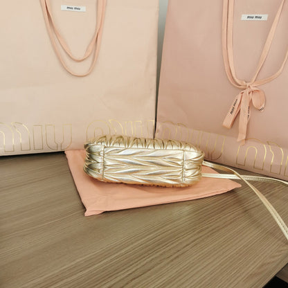 Miumiu - Wander matelassé nappa leather hobo Gold